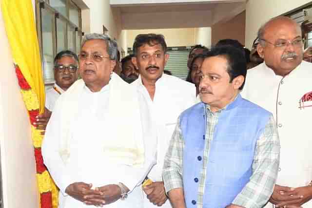 Karnataka CM Siddaramaiah with Minister Zameer Ahmed Khan (in blue jacket)