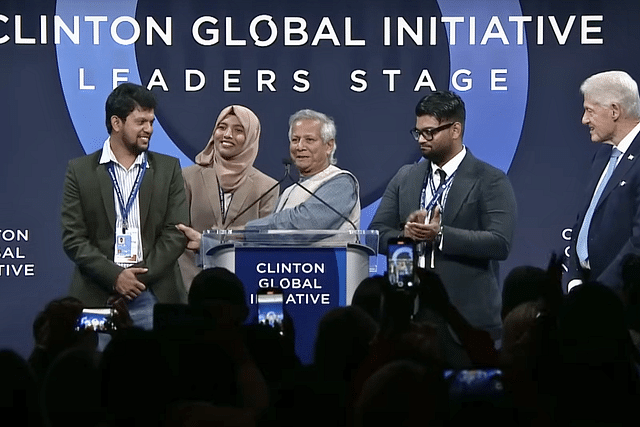 Muhammad Yunus (centre) introduced Mohammad Mahfuz Alam (extreme left) at an event in New York last week; Bill Clinton on stage too