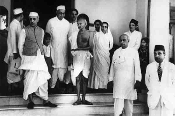 Mahatma Gandhi (centre) with Pandit Jawaharlal Nehru (left) and Vallabhai Patel (right). (Keystone/Getty Images)