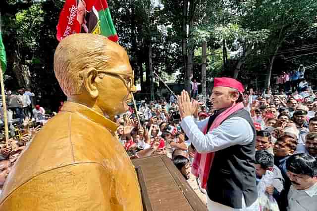 SP chief Akhilesh Yadav in front of a bust of Jayaprakash Narayan