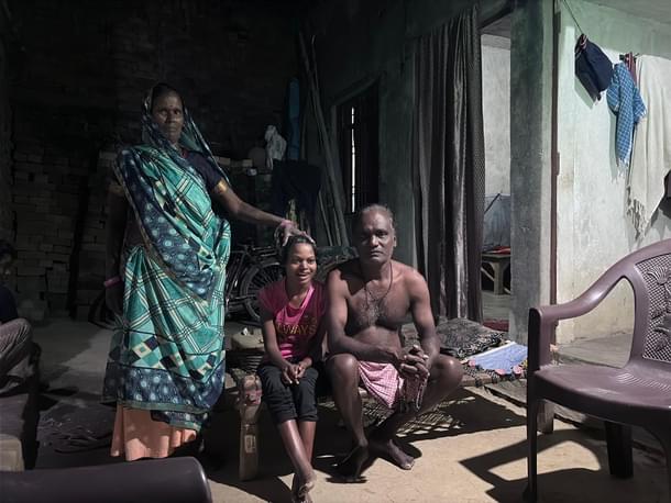 Rinki (centre) with her family. Her mother had to hold her head to support and help her sit.