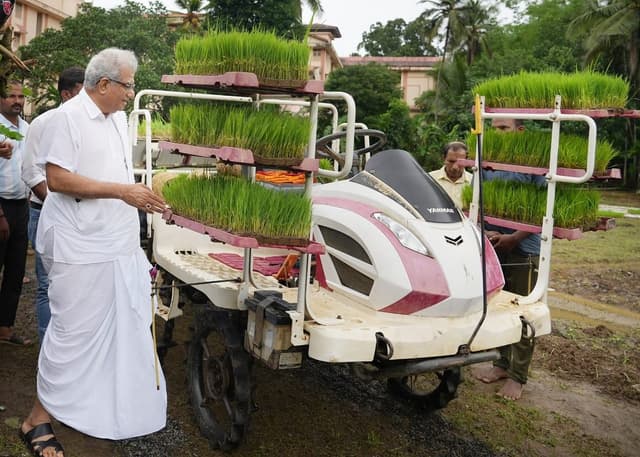 Dharmadhikari Dr Veerendra Heggade inspects an agriculturist's farm.