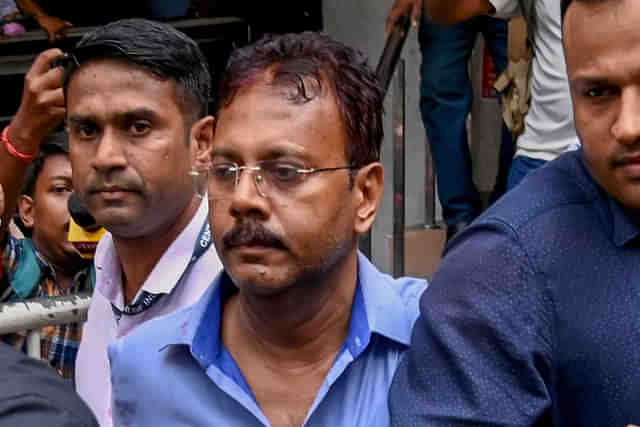 Disgraced former principal of RG Kar Medical College Sandip Ghosh (middle, bespectacled in blue shirt) in CBI custody