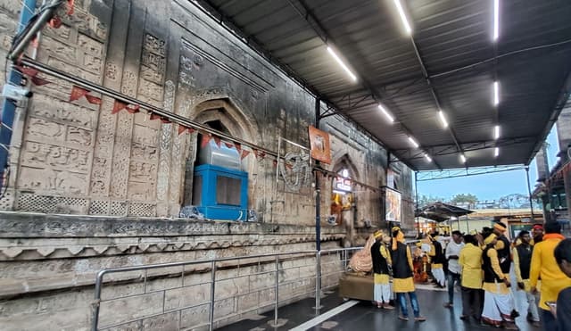 A large number of yellow-clad vanvasi devotees at the Mahakali temple at Chandrapur