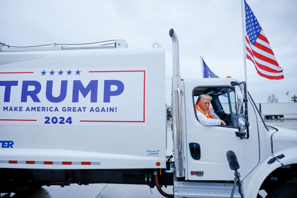 Trump driving a garbage truck.