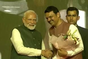 Devendra Fadnavis shakes hand with Prime Minister Narendra Modi after taking oath as Maharashtra CM
