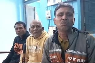 Sudhir Sarkar (centre) flanked by his two sons after their arrest by police in Ambassa, Tripura