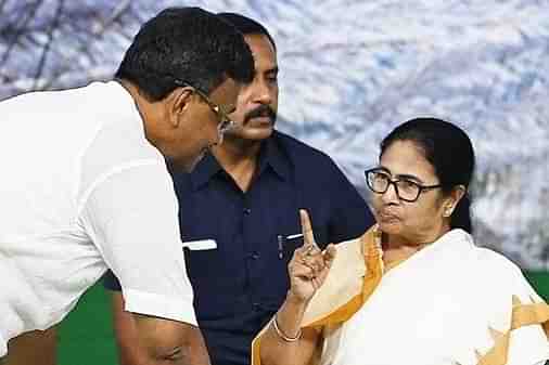 Mamata Banerjee with Firhad Hakim (left)