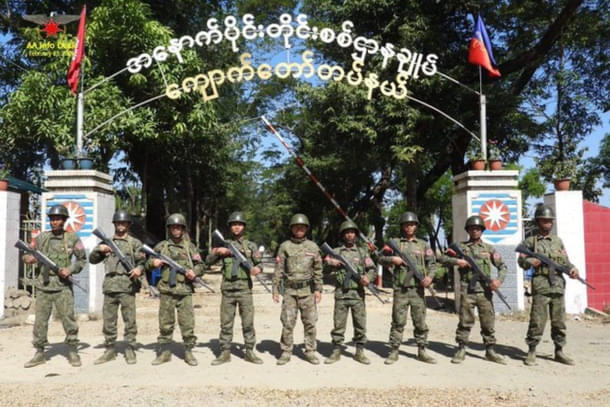 Arakan Army troops after gaining control of a naval base in Rakhine state