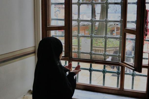 Muslim girl at window