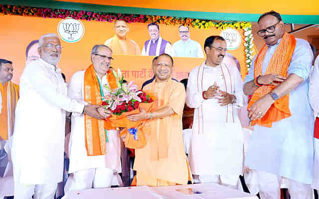 August 2022: Yogi Adityanath felicitating new president of UP BJP Bhupendra Chaudhary (second from left) (X) 
