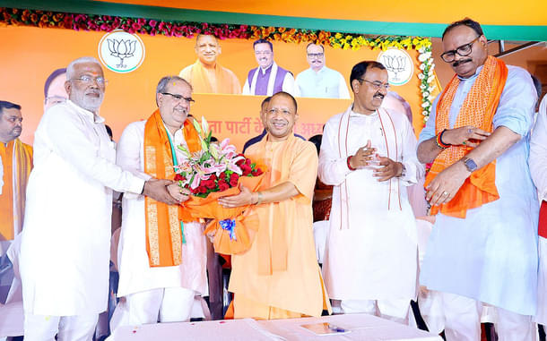 August 2022: Yogi Adityanath felicitating new president of UP BJP Bhupendra Chaudhary (second from left) (X)