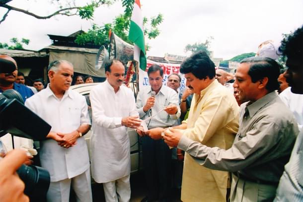 With BS Yediyurappa and Ananth Kumar, collecting funds during Kargil war. Also seen is actor Srinath.