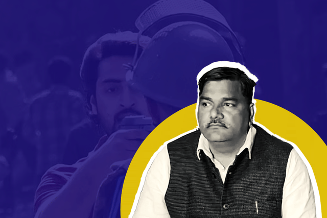 Tahir Hussain. In the background is Shahrukh Khan pointing a gun at the security personnel.