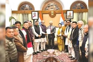Manipur Chief Minister Biren Singh handing over his resignation to Governor Ajay Bhalla (centre, in suit)