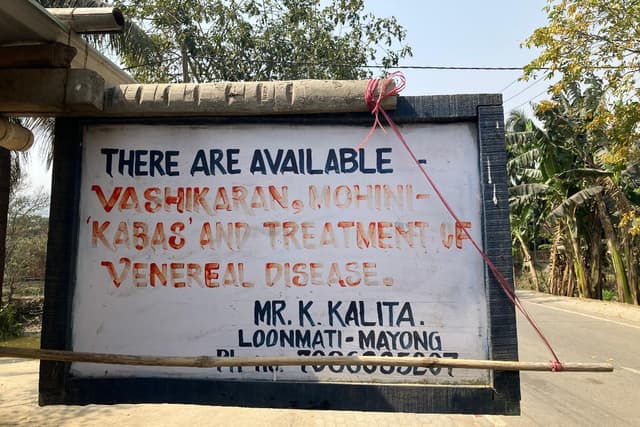 Signboard advertising occult and healing.