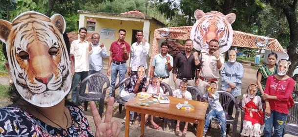 Forest officials celebrating 'Tiger Rakhi' with local children