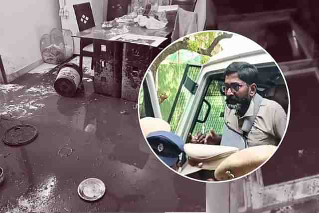 Savukku Shankar's home after it was vandalised. In circle: Shankar. 