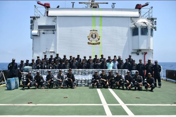 ATS and Coast Guard with intercepted drugs