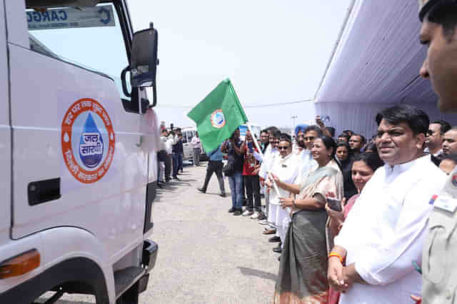 Delhi CM Rekha Gupta flagging off the water tankers