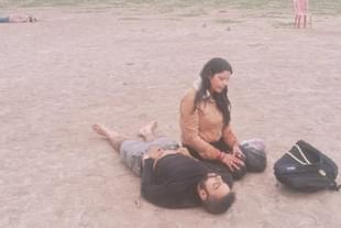 A wife sitting besides her dead husband after Pahalgam terror attack