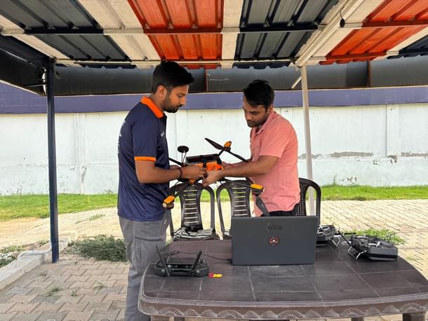 Vivek and his colleague at the pilot training centre.