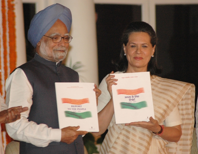 Prime Minister Dr. Manmohan Singh releases the ‘Report to the People 2004–07’ and presents a copy to UPA Chairperson  Sonia Gandhi. (Wikipedia/PIB)
