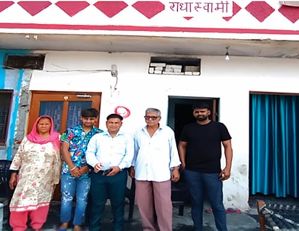 Vinod and his family at their village home.
