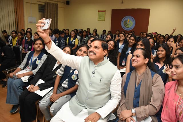 Chief Minister Mohan Yadav interacting with students