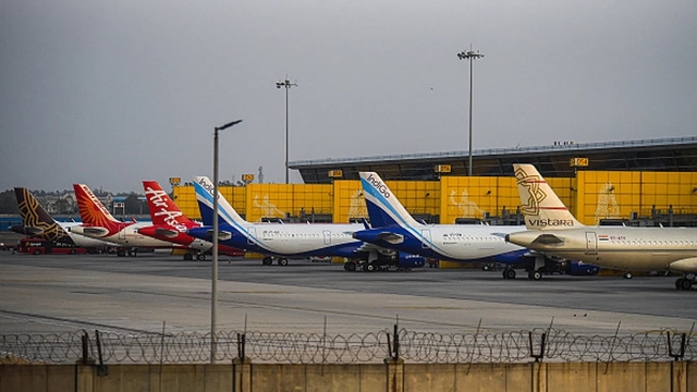 Planes of various Indian carriers parked at an airport. (via Getty Images)