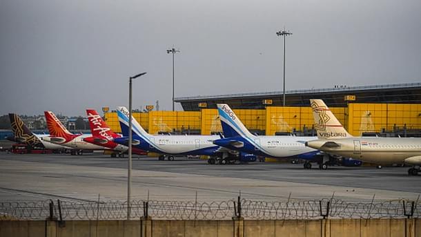 Planes of various Indian carriers parked at an airport. (via Getty Images)