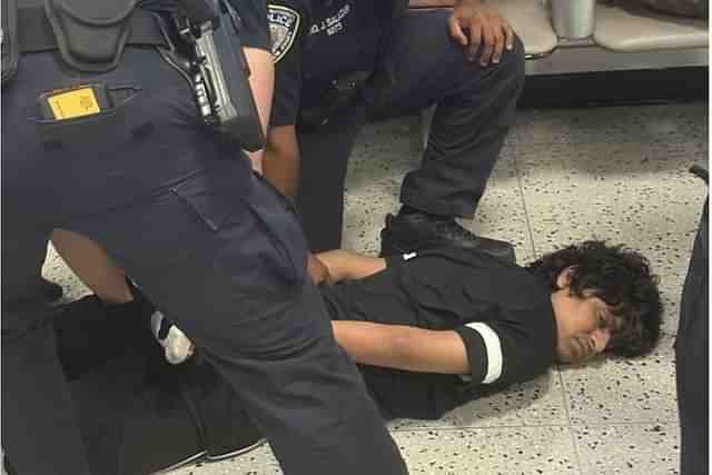 Indian Man Pinned Down At Newark Airport (X/@SONOFINDIA)