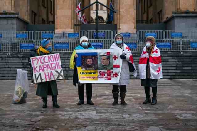People in front of Georgia's Parliament in Tbilisi showing their support for Ukraine. (Claire Harbage/NPR)