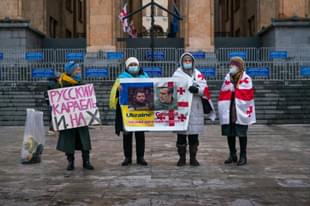 People in front of Georgia's Parliament in Tbilisi showing their support for Ukraine. (Claire Harbage/NPR)