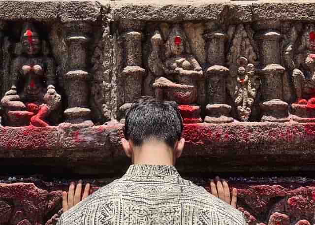 Hands folded, heads bowed — in respect for She Who Bleeds.