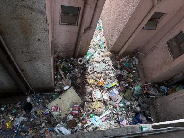 Waste dumped in open spaces within towers.