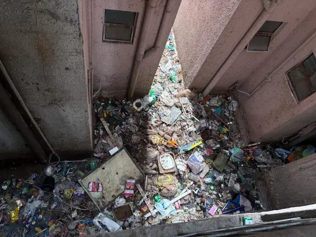 Waste dumped in open spaces within towers.
