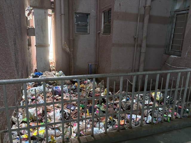 Waste dumped in open spaces within towers.