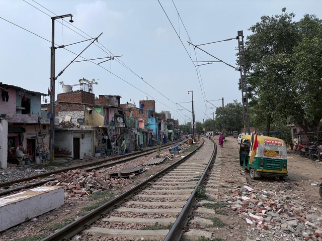 The surrounding slums along the railway track. 