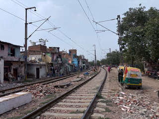 The surrounding slums along the railway track.