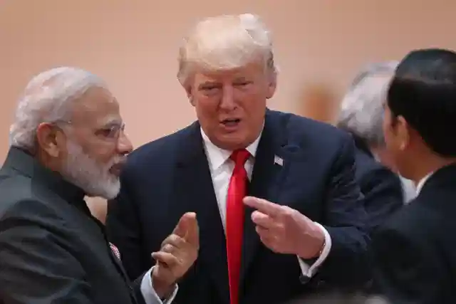 President Donald Trump chats with Prime Minister Narendra Modi on the second day of the G20 summit in Hamburg, Germany. (Sean Gallup/Getty Images)