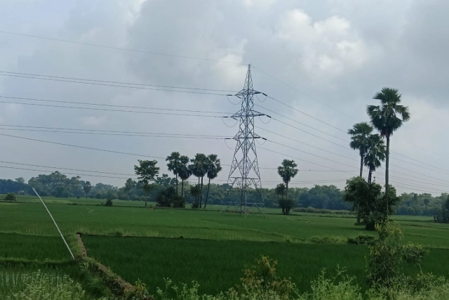 Electricity transmission towers in the farmland.