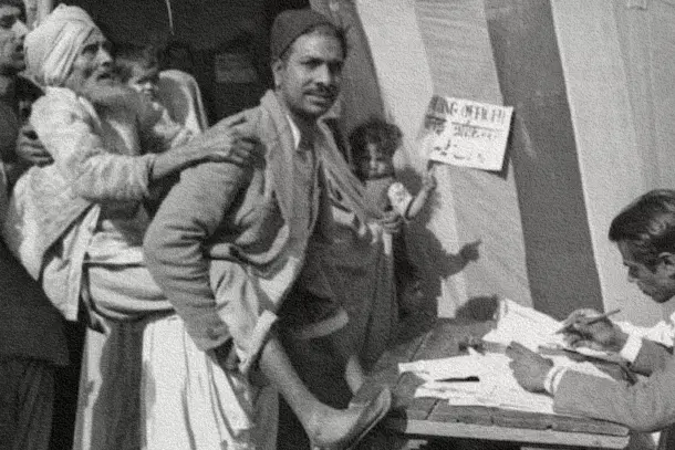 A man carrying an elderly voter to cast vote in the first Lok Sabha election 1951-52. (India Today)