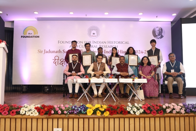 Graduating fellows with Dr Vikram Sampath, Education Minister Dharmendra Pradhan, Prof Shamika Ravi, Devesh Varma from Ola Foundation (Ext Right) and Programme Manager Satyajeeet K Ojha (Ext Left) (FIHCR).