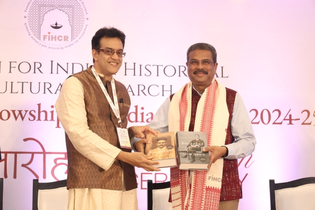 Dr Vikram Sampath presenting his two-part biography of Veer Savarkar to Education Minister Dharmendra Pradhan (FIHCR).
