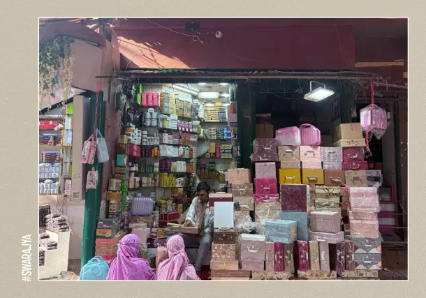 The lane is full of shops selling cosmetics, make up, utensils, and clothes.