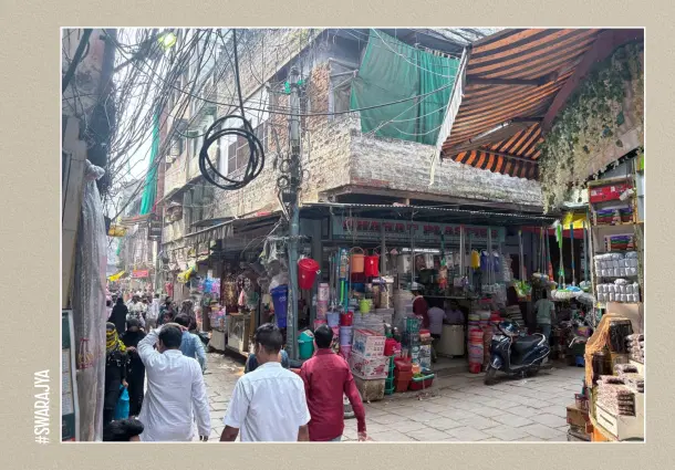 The lane is full of shops selling cosmetics, make up, utensils, and clothes.