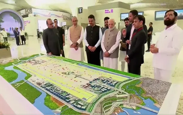 PM Modi being briefed about the details of the airport