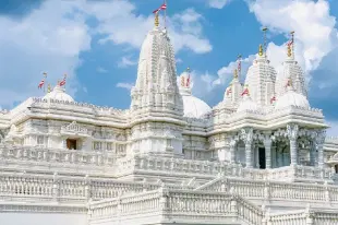 Red & White American Flags atop BAPS Hindu Temple in Atlanta.